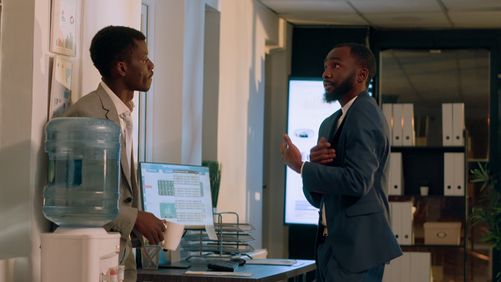 Two colleagues talking in an office